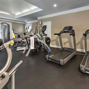 24-hour Fitness Center with free weights and cardio equipment