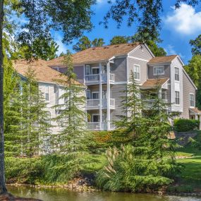 Garden-style community surrounded by lush greenery at Camden Sedgebrook in Huntersville, NC