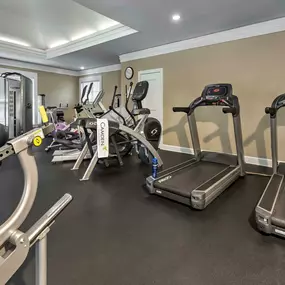 24-hour Fitness Center with free weights and cardio equipment