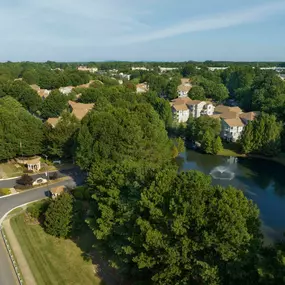 Buildings overlooking pond at Camden Sedgebrook in Huntersville, NC