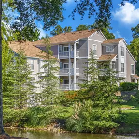 Garden-style community surrounded by lush greenery at Camden Sedgebrook in Huntersville, NC