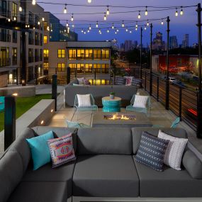 Rooftop Lounge with string lights, fire pits and yard games