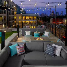 Rooftop Lounge with string lights, fire pits and yard games