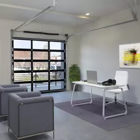 Live/work space with glass-paneled garage door at Camden RiNo apartments in Denver, CO