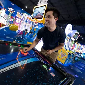 Guests playing air hockey