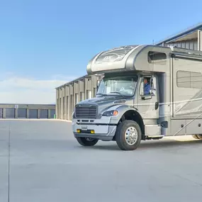 RV backing into a fully enclosed storage unit at Maximum Storage RV and Self Storage