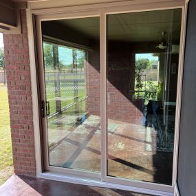 Window Installation of a new sliding door from Energy Window Solutions in the Dallas, TX area.