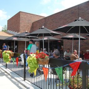 At Sports Cafe, we offer our guests 2 patio options! Our front patio has full service daily from open to close!! Our full menu and Bar selections are available to you with table service!
Our bistro patio is located on the back side of our establishment. This patio does not have servers attending, however, cocktails and food can be brought out on this patio. Both of our patios are open daily with weather permitting! Our establishment is non smoking inside but we do allow smoking outside!