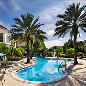 Pool with sun deck and outdoor seating