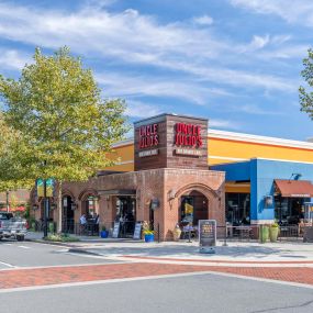 Outdoor dining and shopping area near community