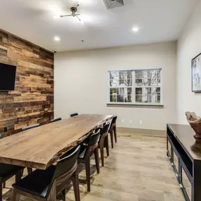 Resident lounge conference and dining table with television