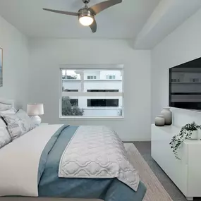 B1 Floor Plan Bedroom with Plush Carpeting at Lighted Ceiling Fan at Camden Lake Eola apartments in Orlando, FL