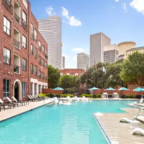 Midtown pool with lounge chairs view of downtown