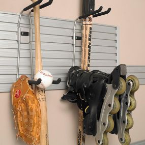 Looking for a way to organize absolutely anything? Our TrackWall is the perfect fit for your garage! Hang up extension cords, tools—or like in this garage, all of your sporting equipment!