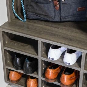 Shoe racks in the garage can be very helpful. They provide a convenient place to store and organize shoes away from the home, reducing clutter and helping to keep dirt and mud from entering the house. Shoe racks can also help keep shoes from getting damaged, as they will be less likely to get steppe