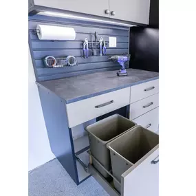 Conceal and contain effortlessly with our built-in trash cans, integrated into garage cabinets for a seamlessly clean and organized space.