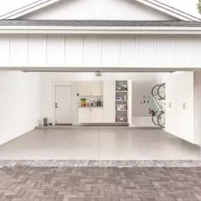 Look how bright and fresh this garage is! How did we do it? We upgraded the Garage Storage—and installed easy to clean PremiereOne Garage Flooring!