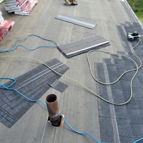 Shingles being installed over Ice Shield on a low pitch roof.