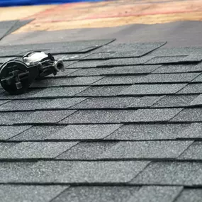 Roof nailer on a partially shingled roof