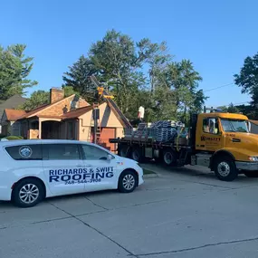 Shingles being loaded on to a roof