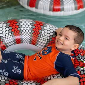 Guest lounging in lazy river