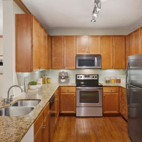 Kitchen with glass cooktop and granite countertops