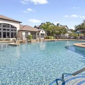 Resort-style pool and clubhouse at Camden Amber Oaks apartments in Austin, TX