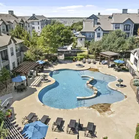 Aerial view of resort-style pool and sundeck at Camden Amber Oaks apartments in Austin, TX