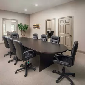 Conference room with meeting large table and chairs at Camden Amber Oaks