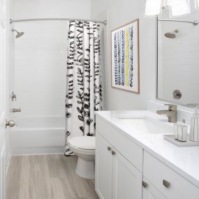 Modern-style bathroom with white cabinets and quartz countertops at Camden Royal Palms apartments in Brandon, FL