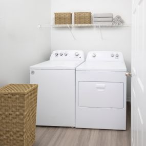 Full-size washer and dryer in laundry room at Camden Royal Palms apartments in Brandon, FL