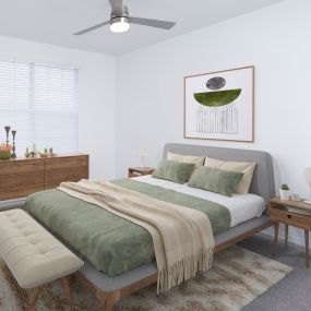 Bedroom with lighted ceiling fan at Camden Royal Palms apartments in Tampa, FL