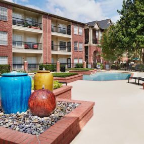 Pool with water features at Camden Stonebridge Apartments in Houston, TX