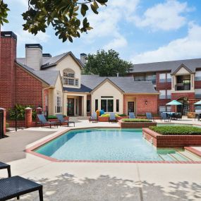 Pool with lounge chairs at Camden Stonebridge Apartments in Houston, TX