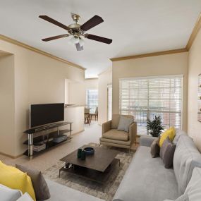 Living room with 9 ft ceilings with crown molding at Camden Stonebridge Apartments in Houston, TX