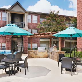 Outdoor grills and dining area at Camden Stonebridge Apartments in Houston, TX