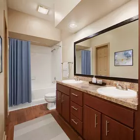 Modern espresso cabinets with brushed nickel fixtures at Camden Stonebridge Apartments in Houston, TX