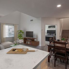 Open concept townhome kitchen living dining room wood style flooring throughout