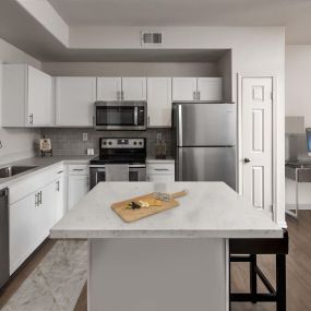 Townhome kitchen island stainless steel appliances near home office