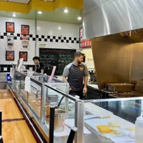 Employee's at Taystee's Burgers in Dearborn, MI working behind the counter