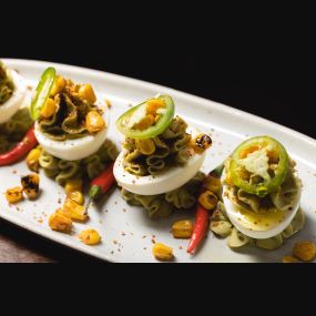 Kick off your meal at The Independent with our fun and festive Fiesta Deviled Eggs by the Theatre District