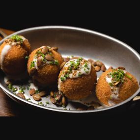 Share Sweet Potato Croquettes with the table at The Independent in Midtown Manhattan