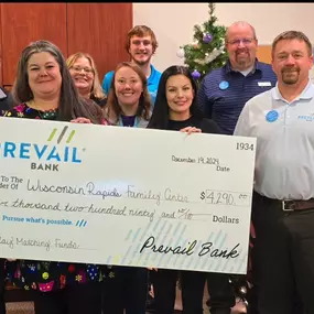 Prevail Bank holiday matching 'big check' to Wisconsin Rapids Family Center.