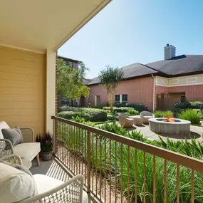 Private apartment patio overlooking firepit courtyard