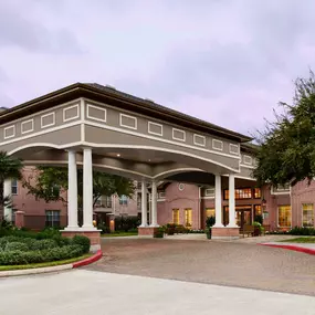 Porte cochere covered entry into community