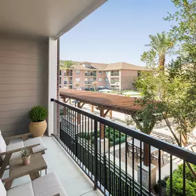 Balcony overlooking the resort-style pool at Camden Royal Oaks Apartments in Houston, Tx