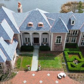 The Shake Guys Team installed a composite DaVinci Multi-Width Province Slate Roofing System on this grand Inverness home! The tile color is called European. Custom Copper, and Skylights were also installed. Incredible job Team!