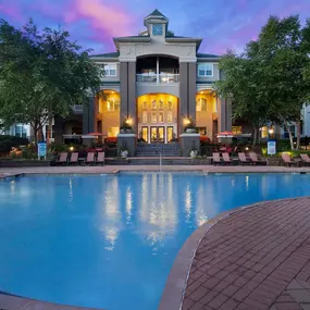 Large outdoor pool at night at Camden Westwood apartments in Morrisville, NC