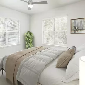 Bedroom with natural lighting and lighted ceiling fan at Camden Westwood in Morrisville, NC