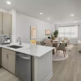 Contemporary finish style features mocha matte cabinets, white quartz countertops, white subway tile backsplash, stainless steel appliances, and USB-enabled outlets at Camden Westwood apartments in Morrisville, NC